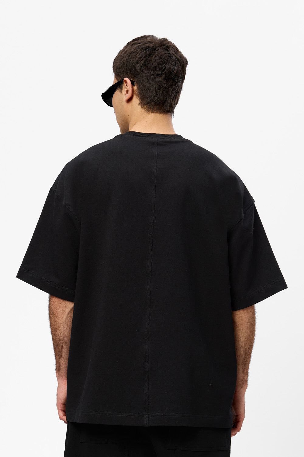 Oversized black T-shirt with decorative stitches