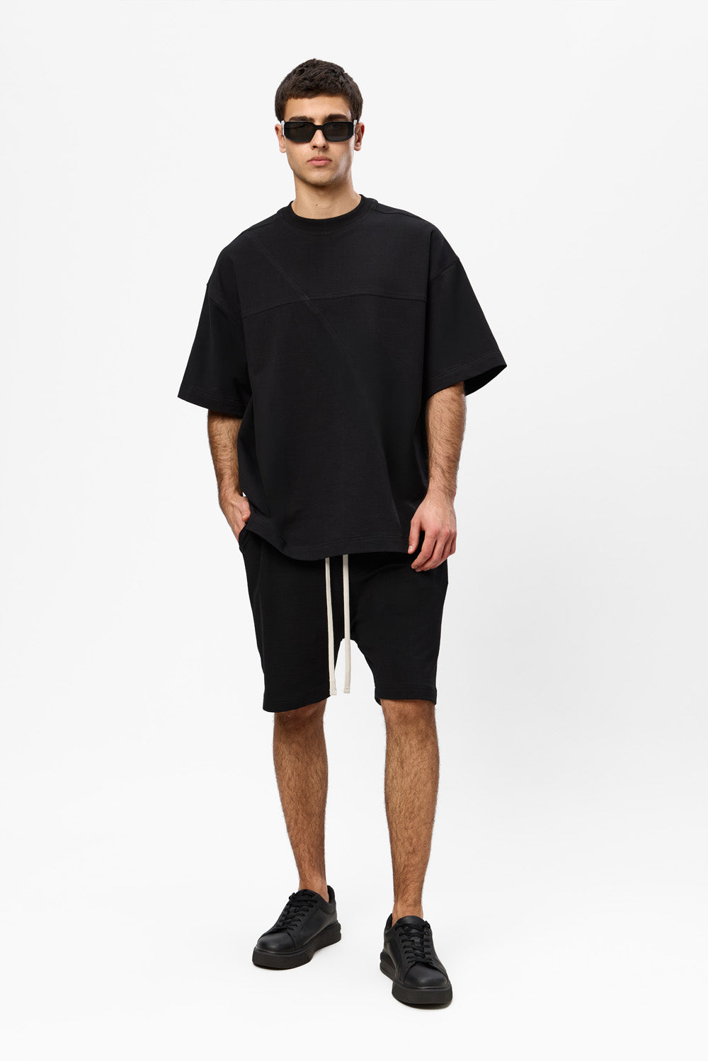 Oversized black T-shirt with decorative stitches