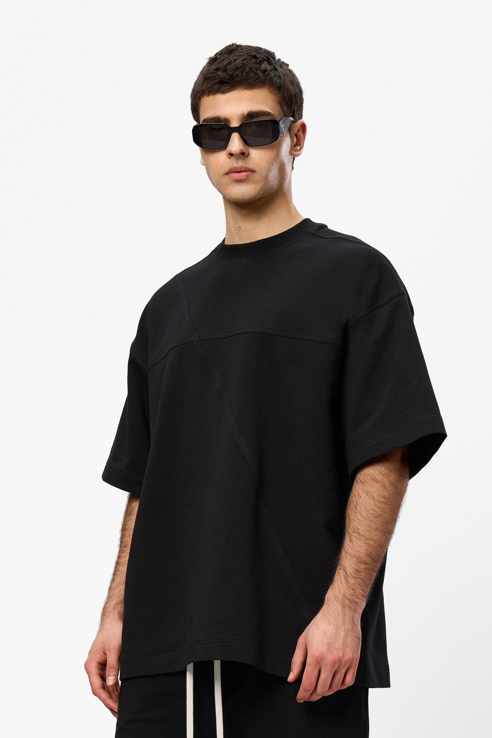 Oversized black T-shirt with decorative stitches