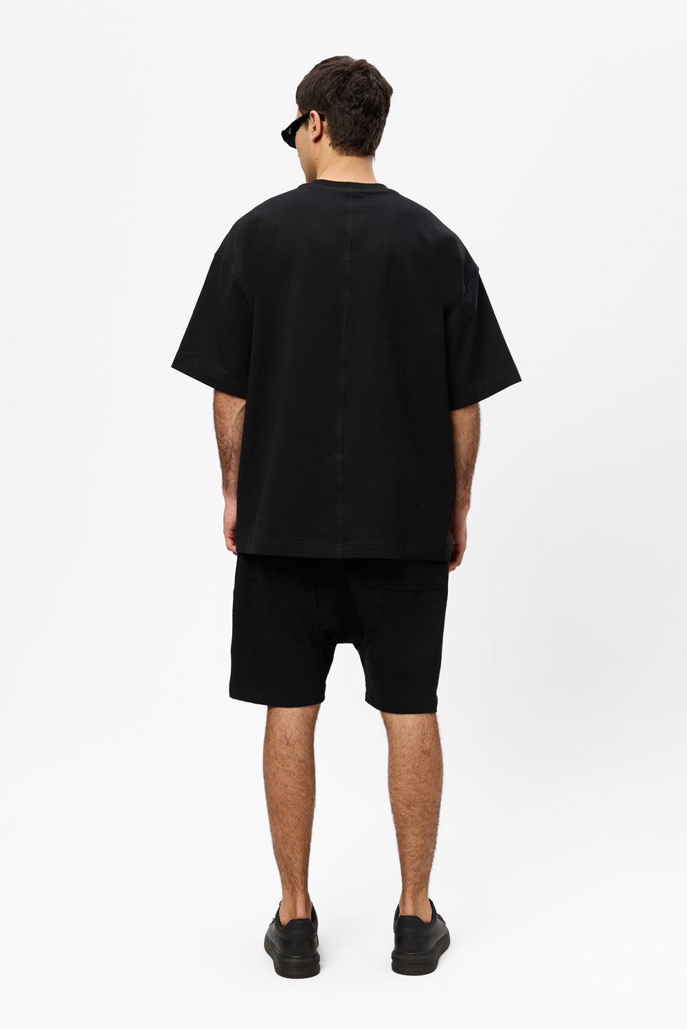 Oversized black T-shirt with decorative stitches