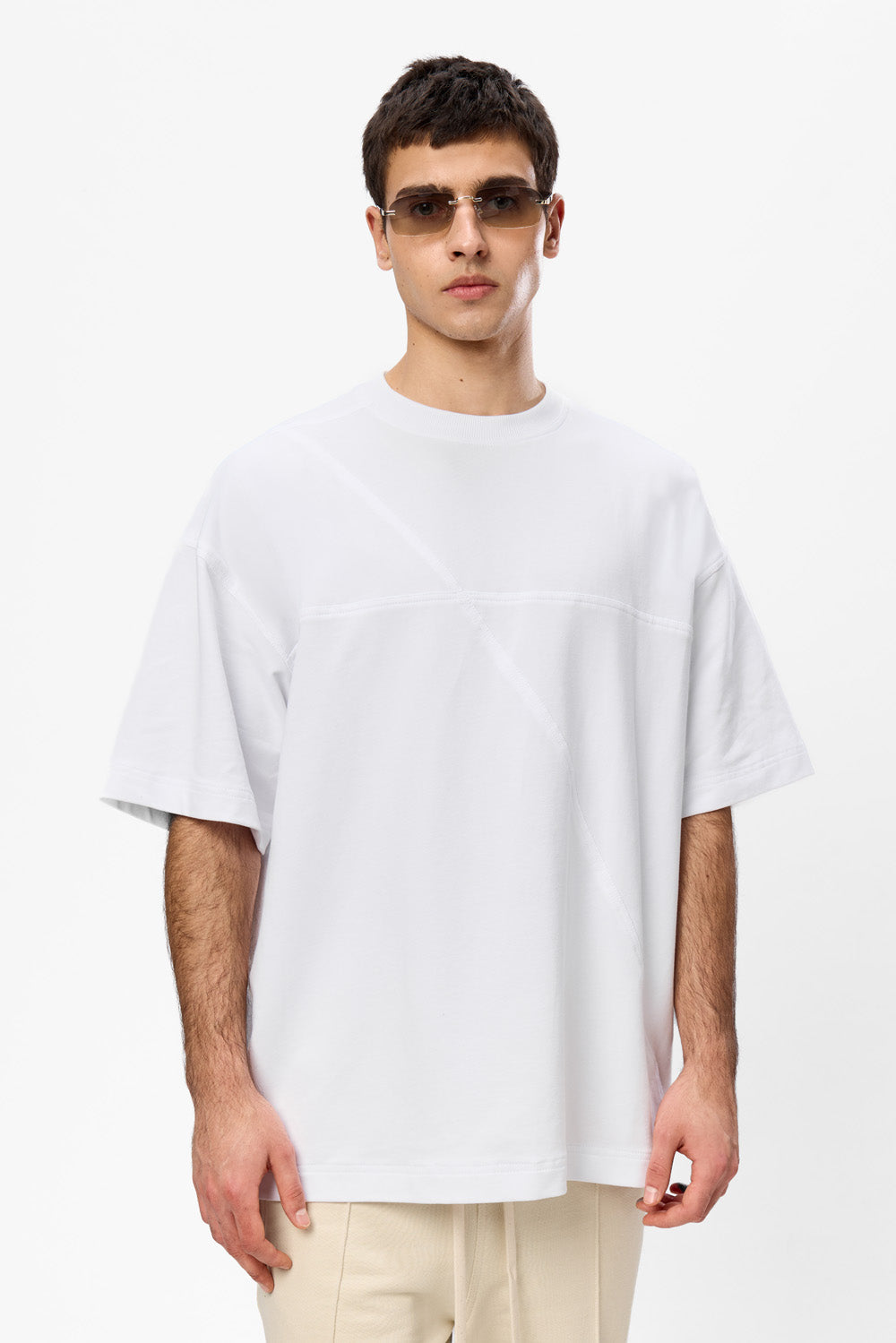 Oversized white T-shirt with decorative stitches