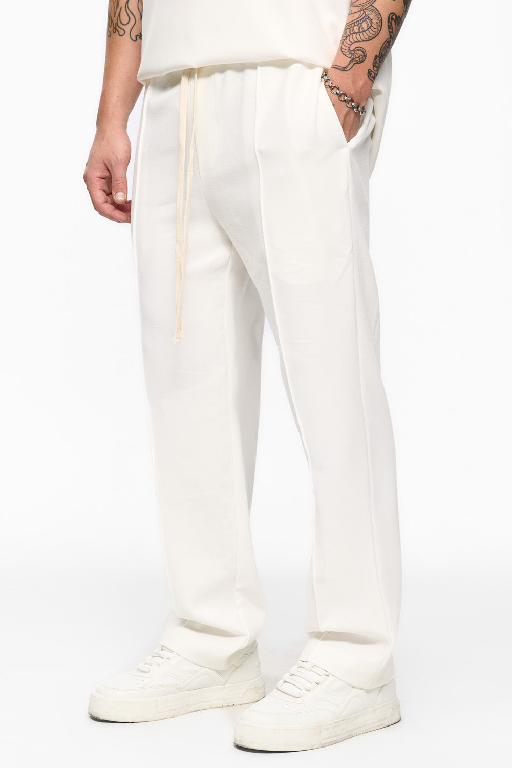 White pants 247 from atelier hamza. Buy now